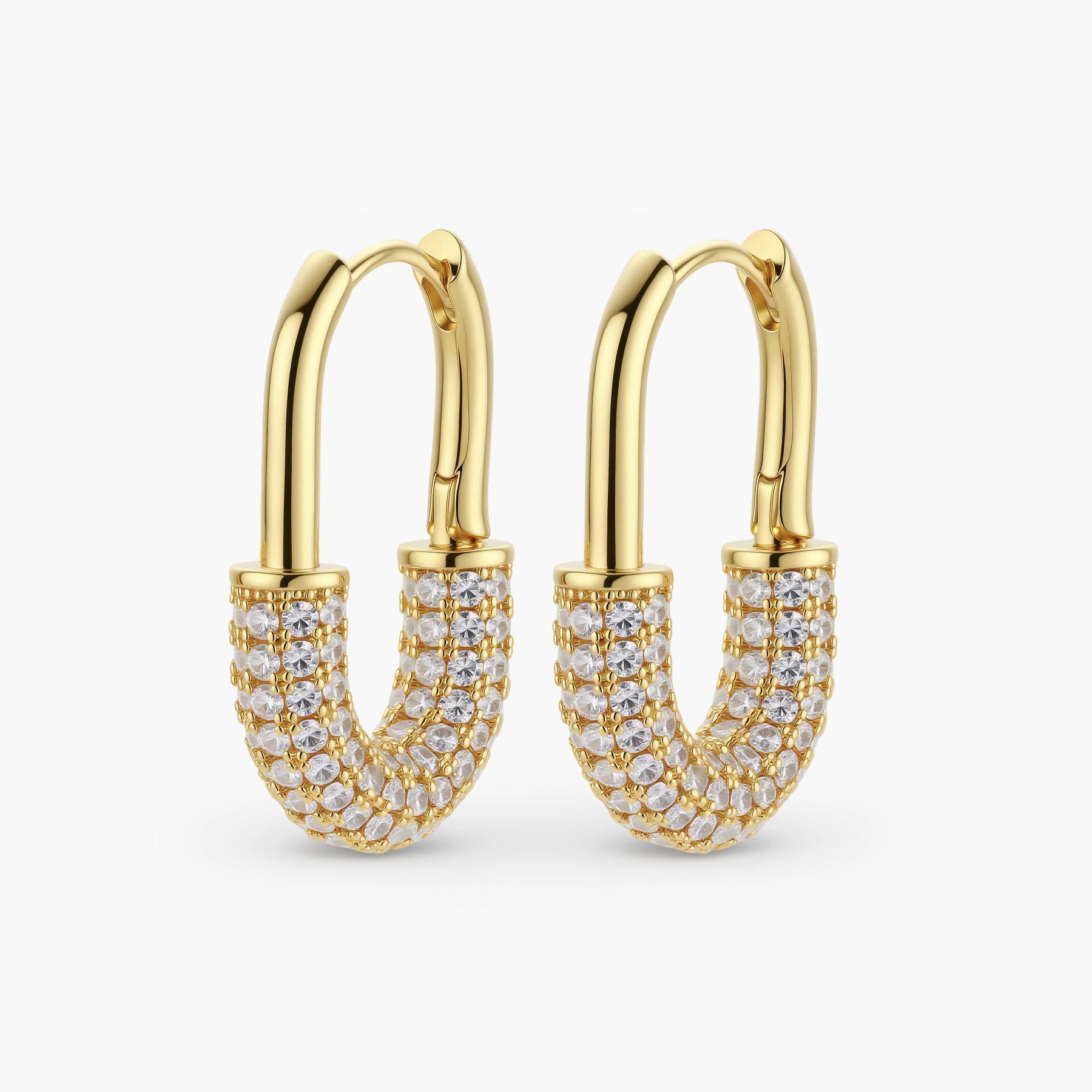 Gold-plated huggie hoop earrings with pavé zirconia stones covering the bottom curve, shown in open and closed positions.