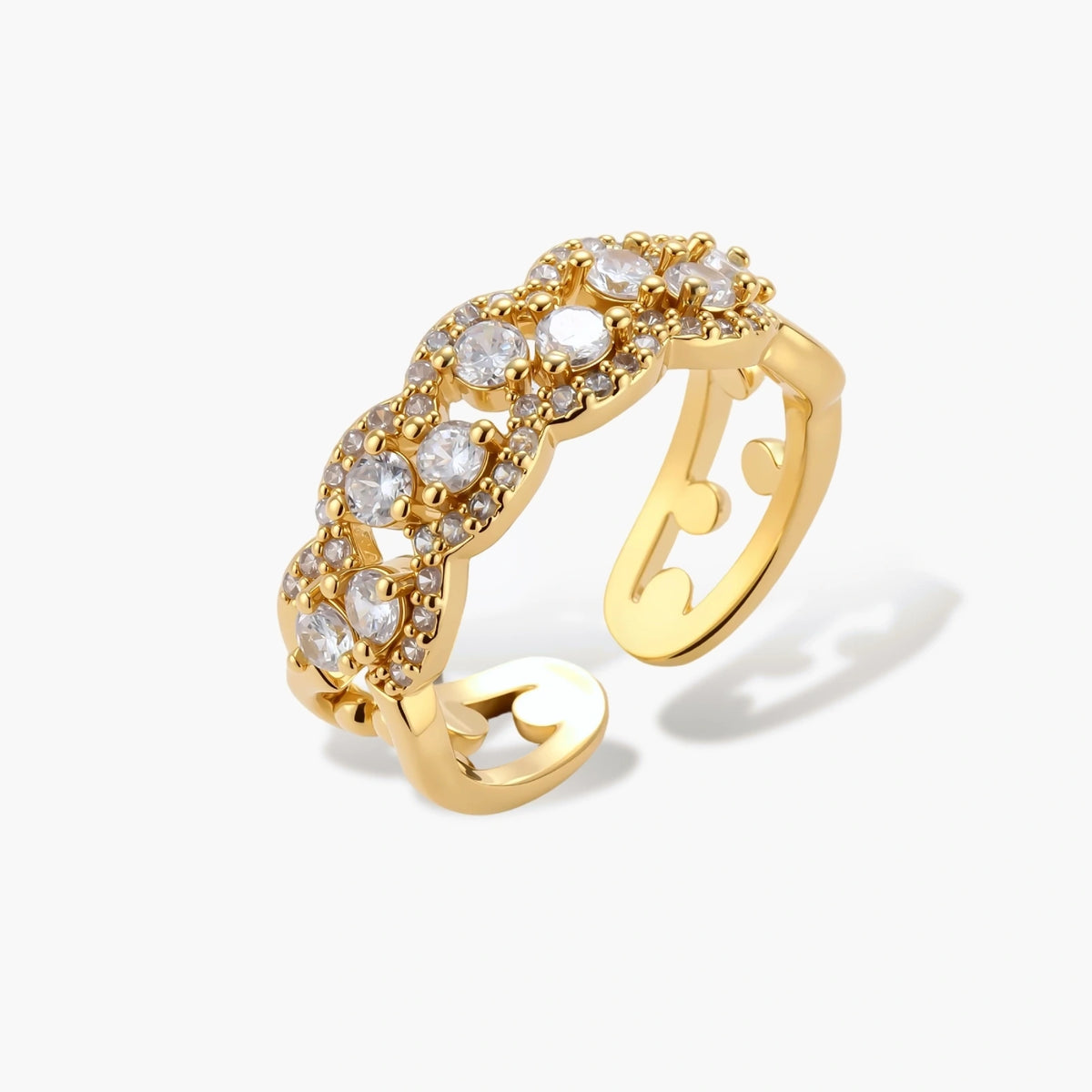 Adjustable gold-plated ring with multiple crystal clusters in intricate chain design on cream background.