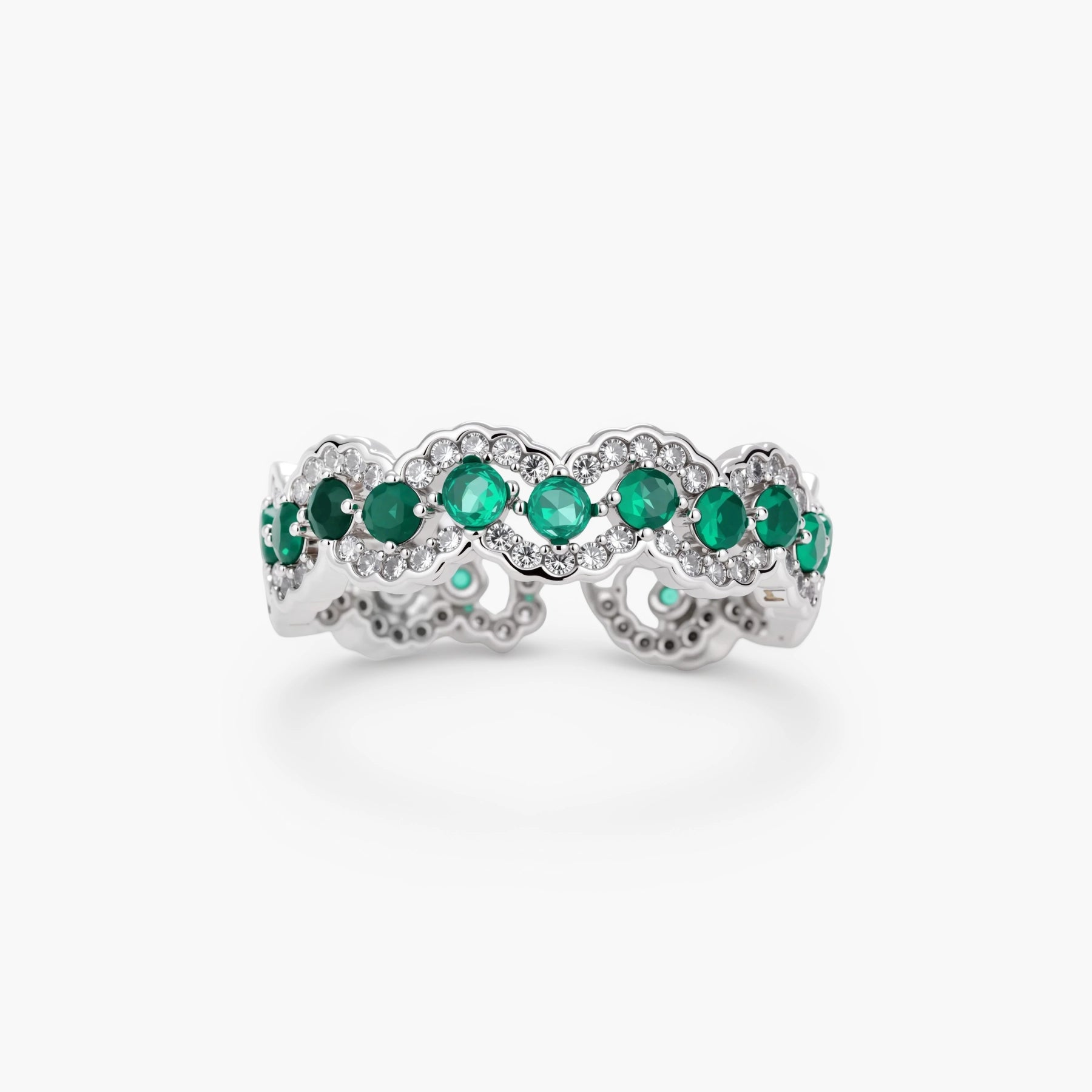 Platinum-plated copper ring with green zirconia stones in decorative scalloped wave pattern, adjustable band design.