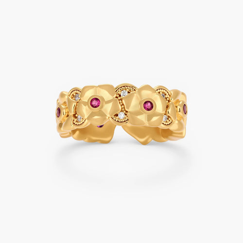 Adjustable gold-plated ring with burgundy zirconia centered flowers and crystal accents on cream background.