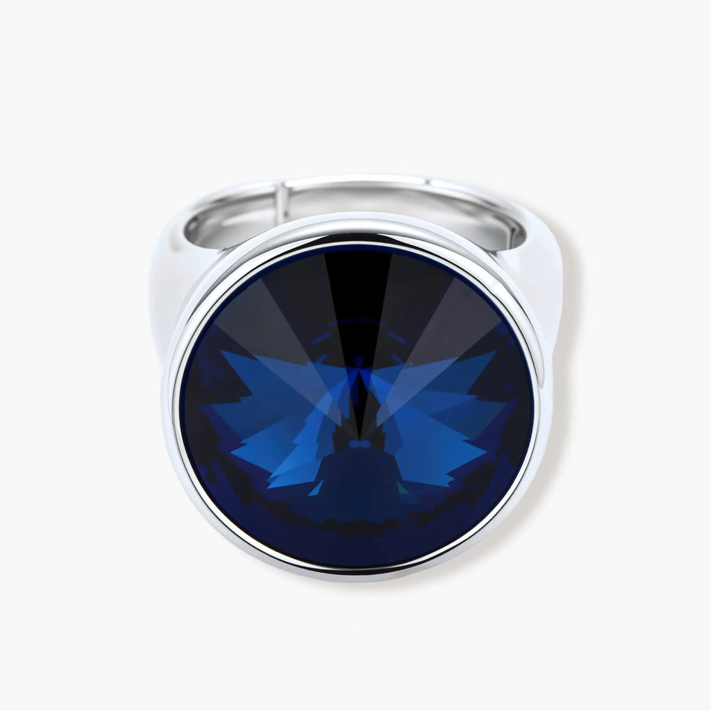 Large oval blue cubic zirconia ring in palladium-plated setting with adjustable band design on neutral background.