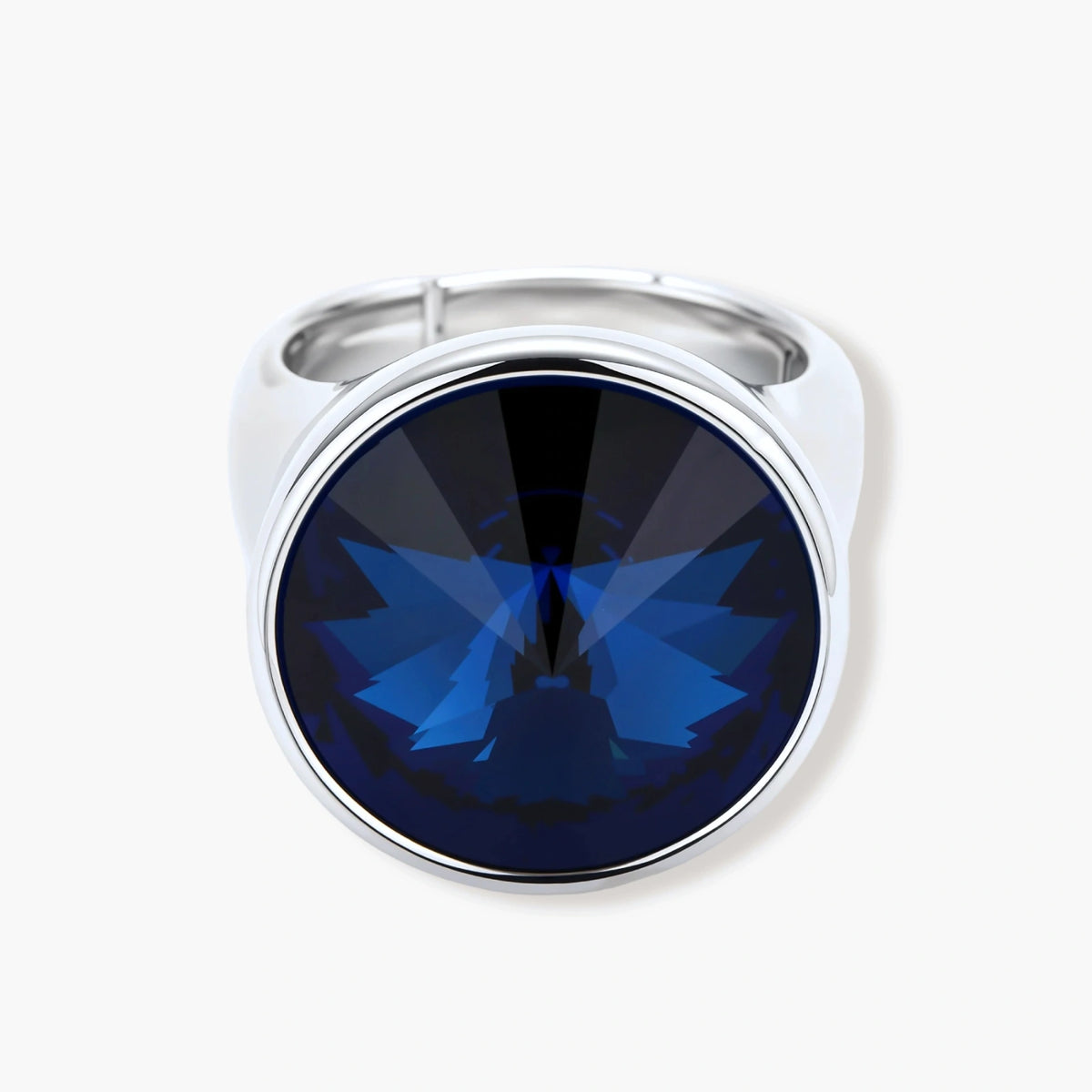 Large oval blue cubic zirconia ring in palladium-plated setting with adjustable band design on neutral background.