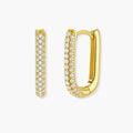 Close-up of gold-plated sterling silver huggie earrings with pave-set crystals creating a continuous sparkle around the hoop