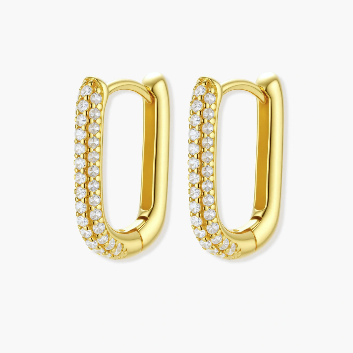 Close-up of gold-plated sterling silver huggie earrings with pave-set crystals creating a continuous sparkle around the hoop