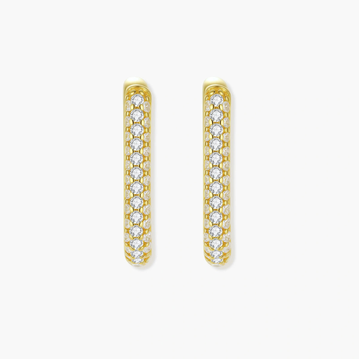Close-up of gold-plated sterling silver huggie earrings with pave-set crystals creating a continuous sparkle around the hoop