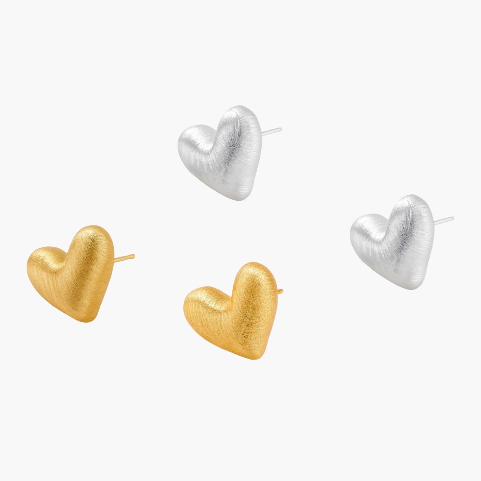 Pair of textured heart-shaped stud earrings in brushed platinum-plated sterling silver against cream background.