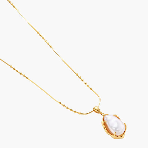 18K gold-plated sterling silver necklace with alternating bead chain and baroque pearl pendant on neutral background.