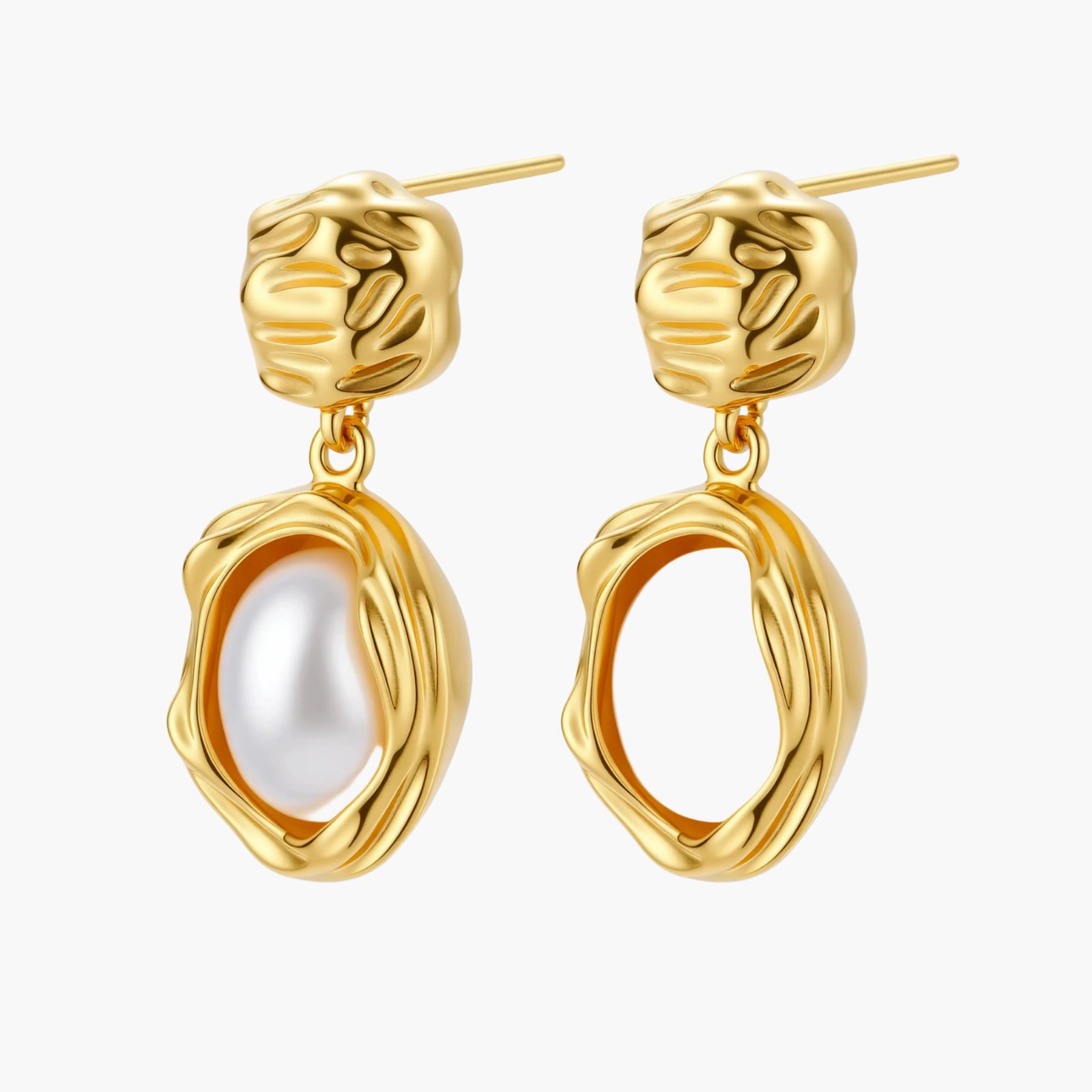 Gold-plated textured stud earrings with white freshwater pearl drops against cream background, showing organic rippled design