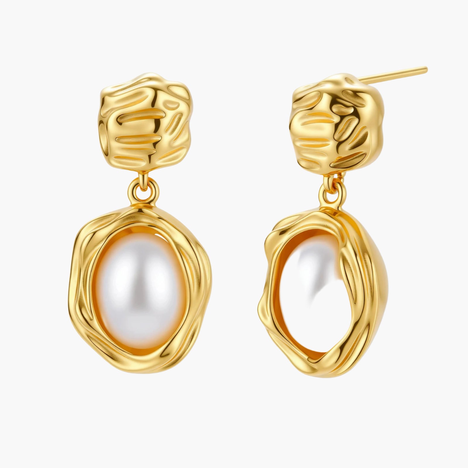 Gold-plated textured stud earrings with white freshwater pearl drops against cream background, showing organic rippled design