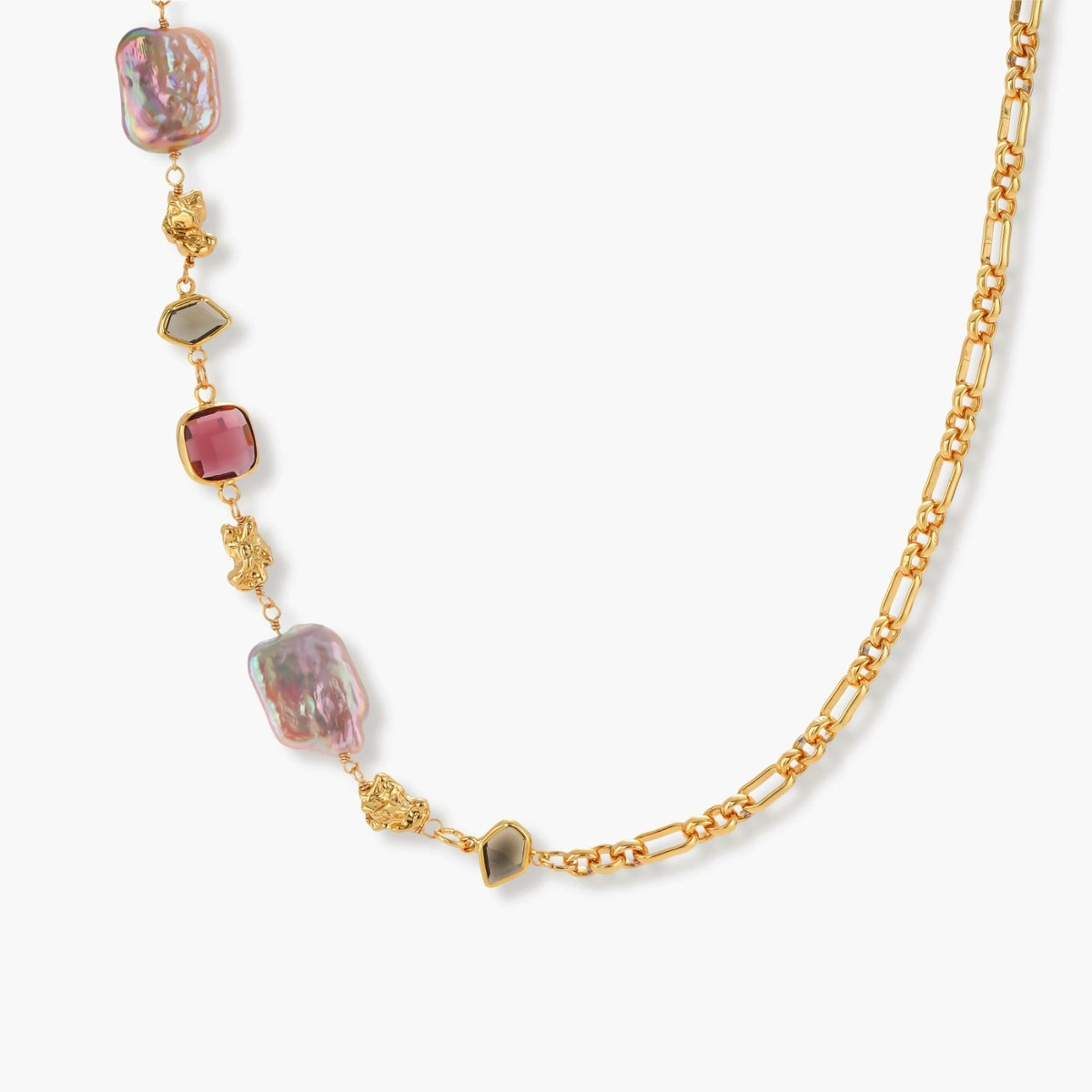 18k gold-plated chain necklace with iridescent baroque pearls and burgundy gemstones on white background.