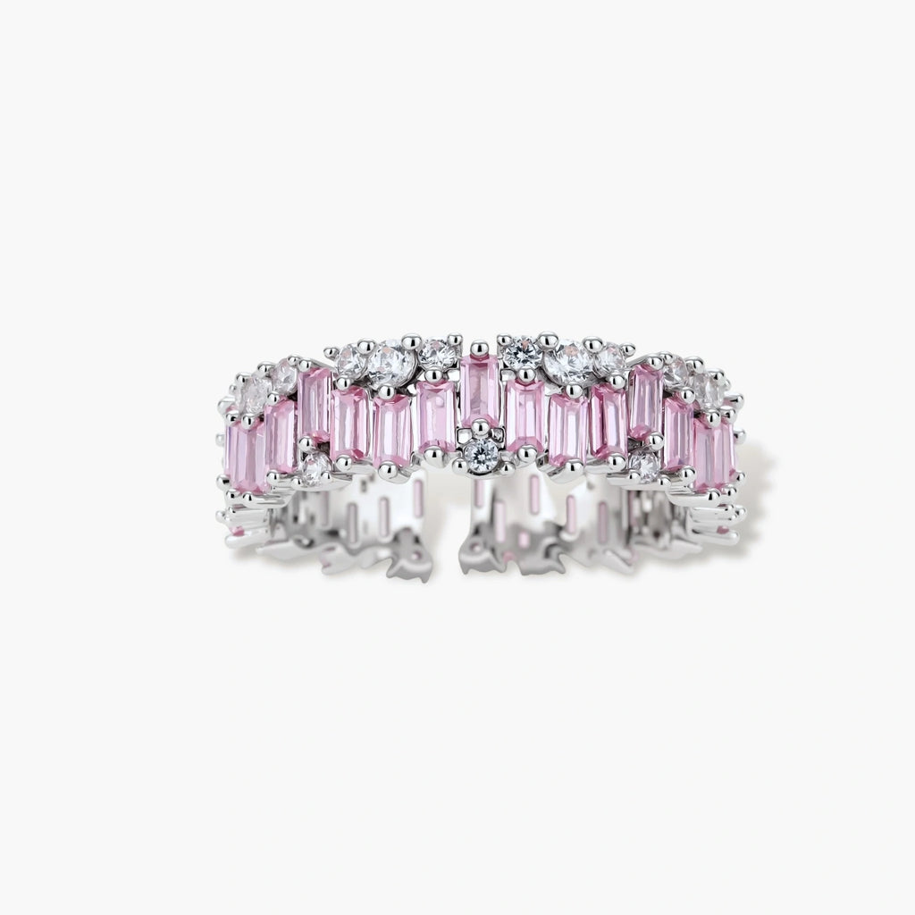 Adjustable eternity ring with alternating pink baguette and clear round cubic zirconia stones in palladium-plated setting