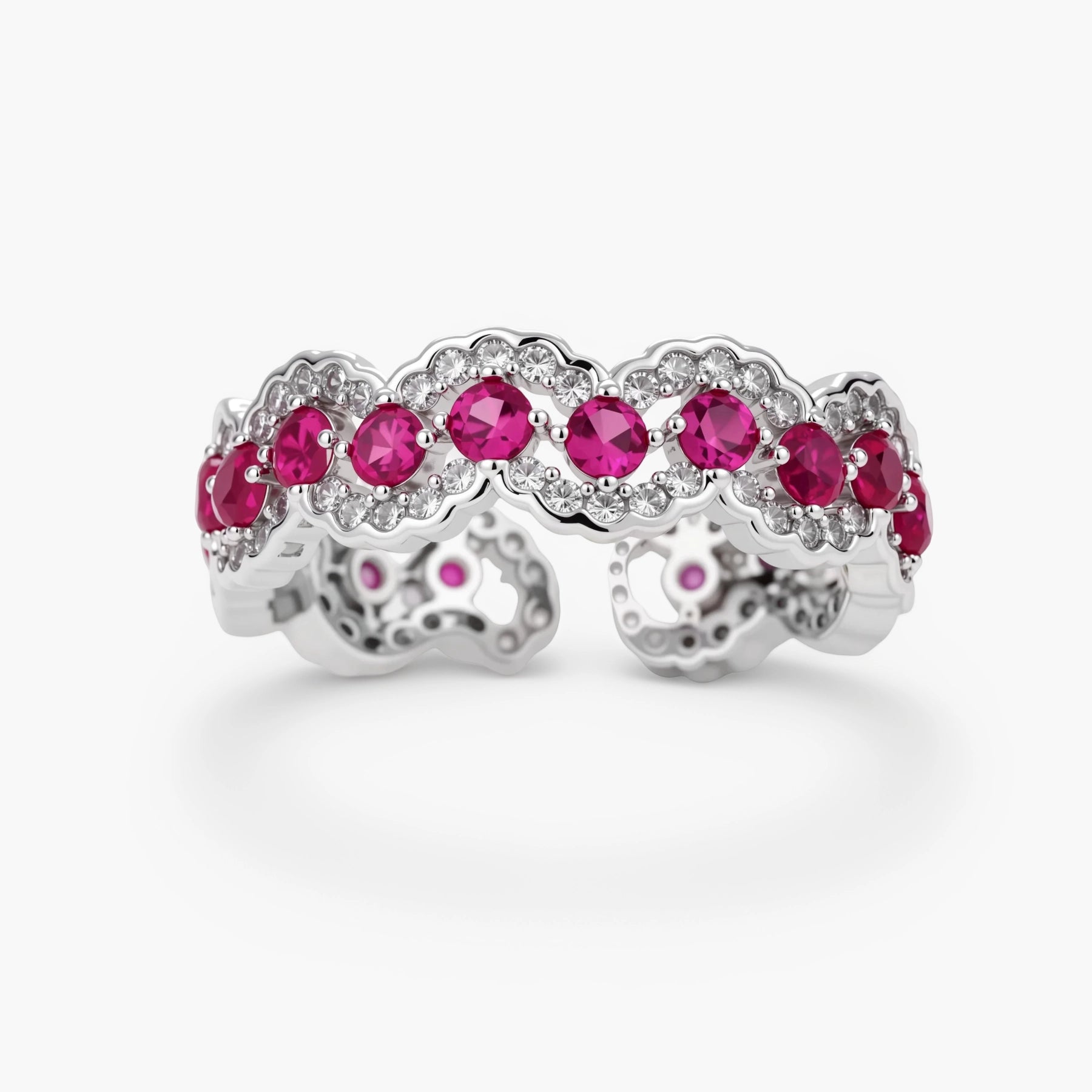 Ornate adjustable ring with pink cubic zirconia stones in white gold-plated copper setting with floral metalwork details