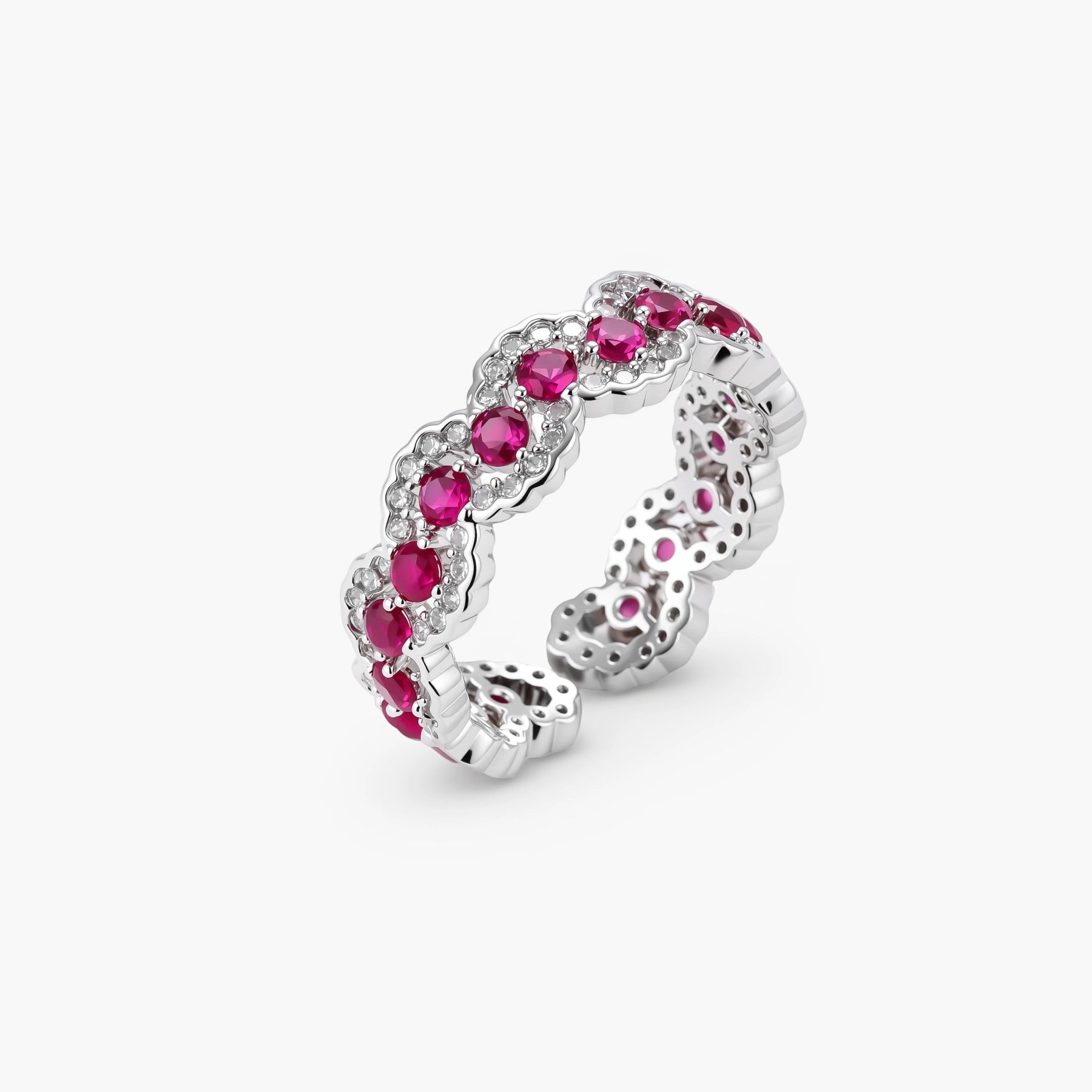 Ornate adjustable ring with pink cubic zirconia stones in white gold-plated copper setting with floral metalwork details