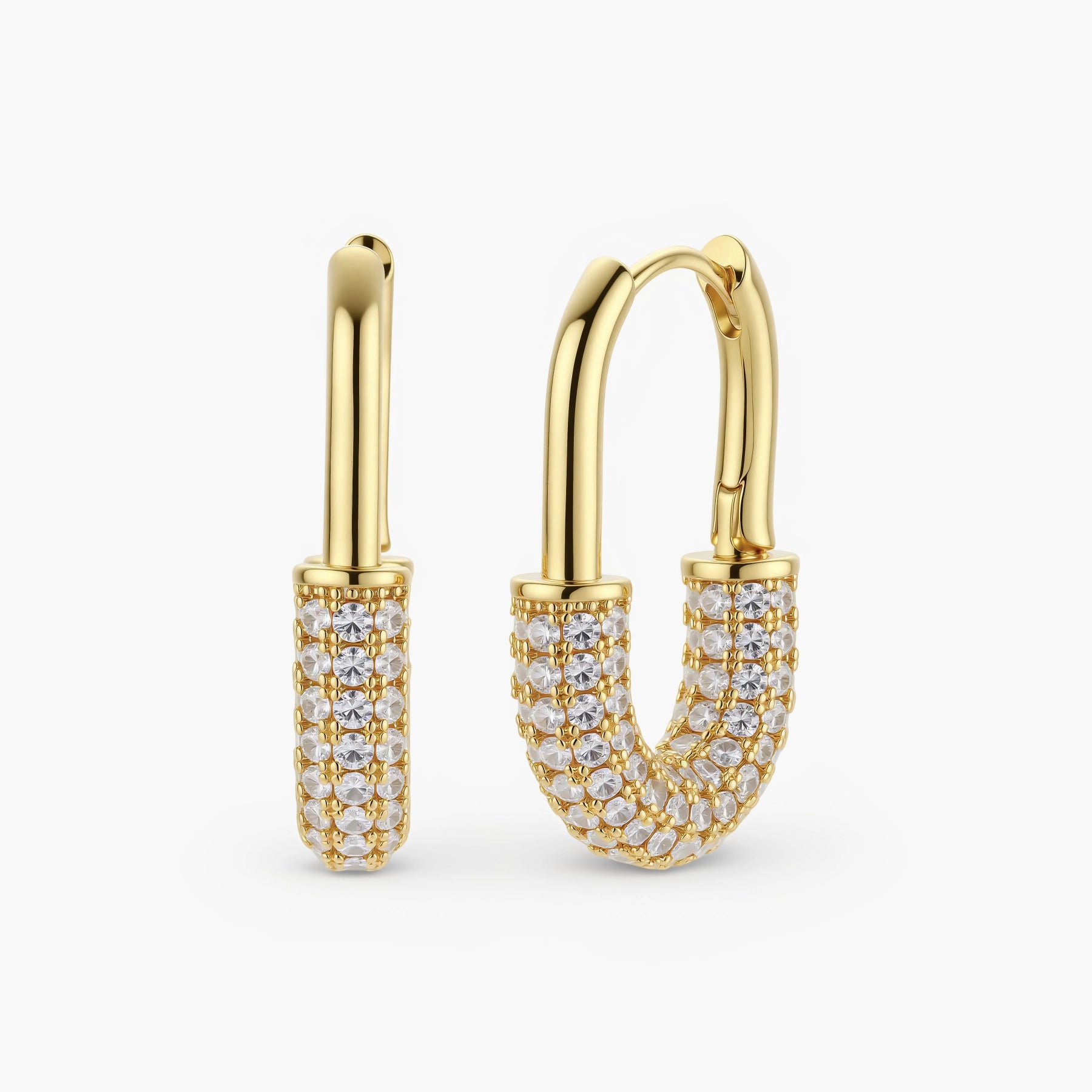 Gold-plated huggie hoop earrings with pavé zirconia stones covering the bottom curve, shown in open and closed positions.
