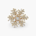 Geometric snowflake brooch with 14K gold-plated copper setting and clear zirconia crystals arranged in radiating pattern.