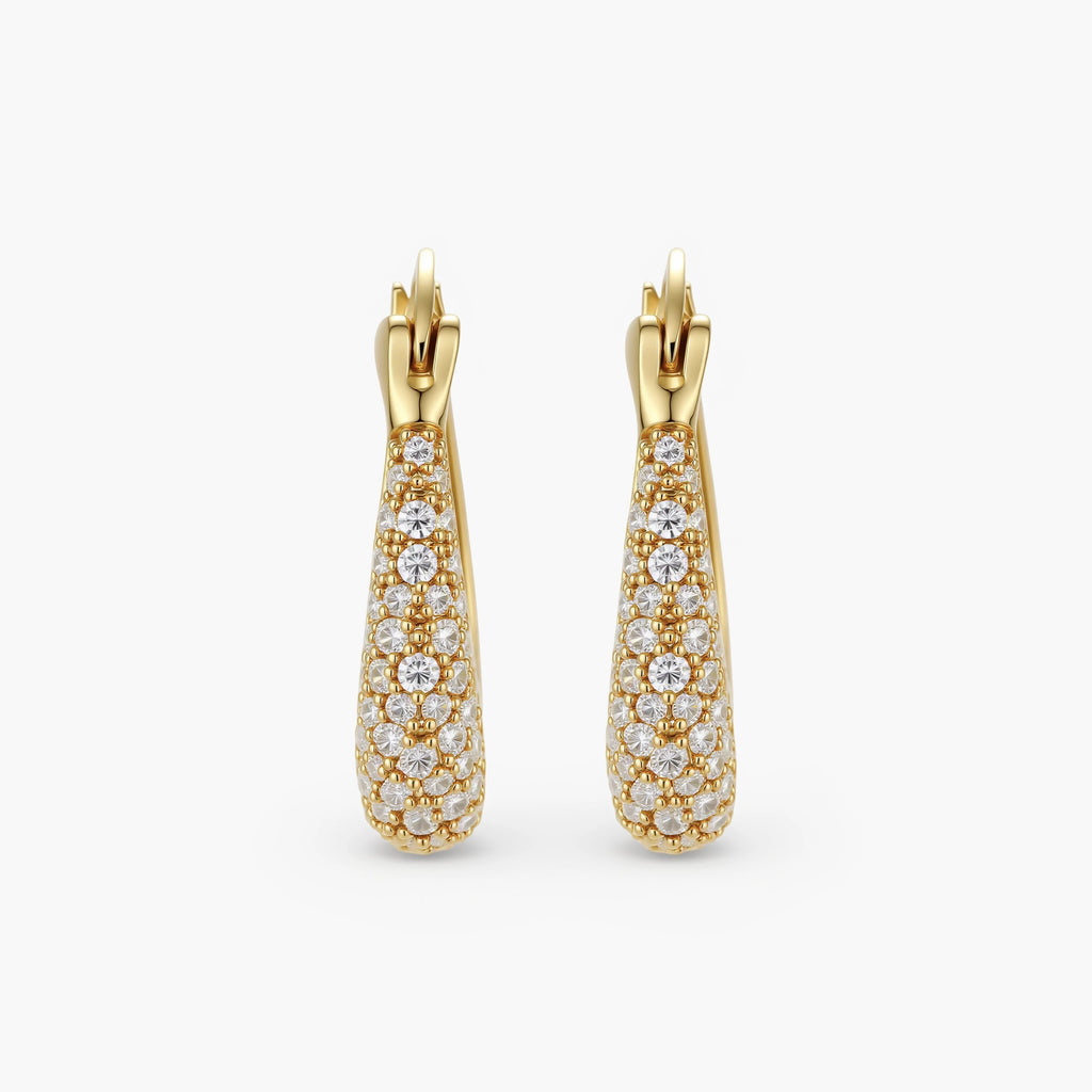 Gold-plated hoop earrings fully covered in sparkling zircon crystals with hinged closure on neutral background