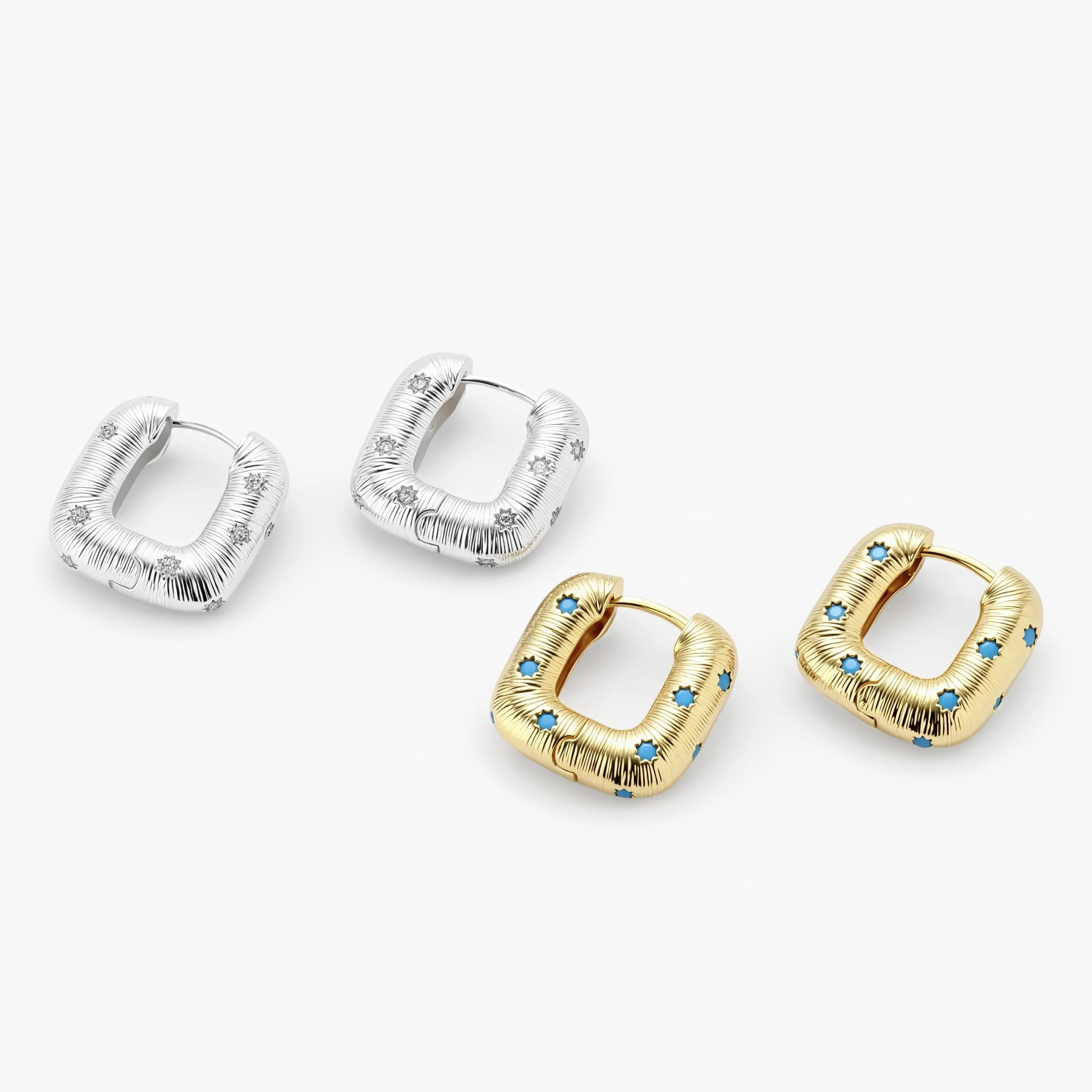 Gold-plated huggie hoop earrings with blue star inlays and textured surface, shown against white background.