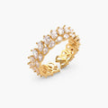 Adjustable gold-plated ring with double-row pear-shaped cubic zirconia stones in geometric pattern on cream background.