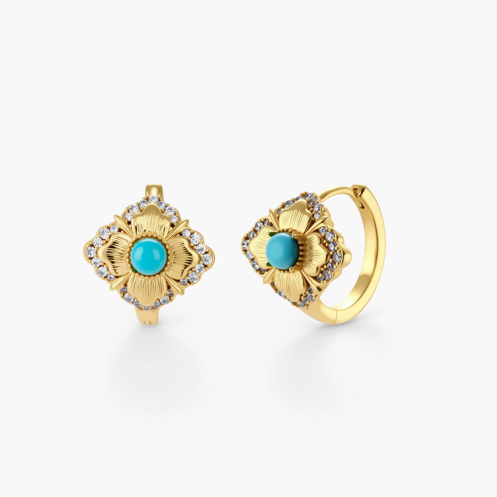 Close-up of 18K gold plated hoop earrings with turquoise center stones and zircon crystals in quatrefoil flower design