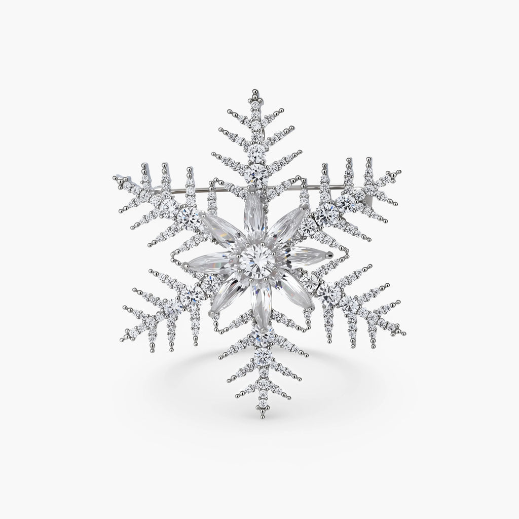 Intricate snowflake brooch with palladium-plated copper setting and sparkling zircon stones in radiating crystal pattern