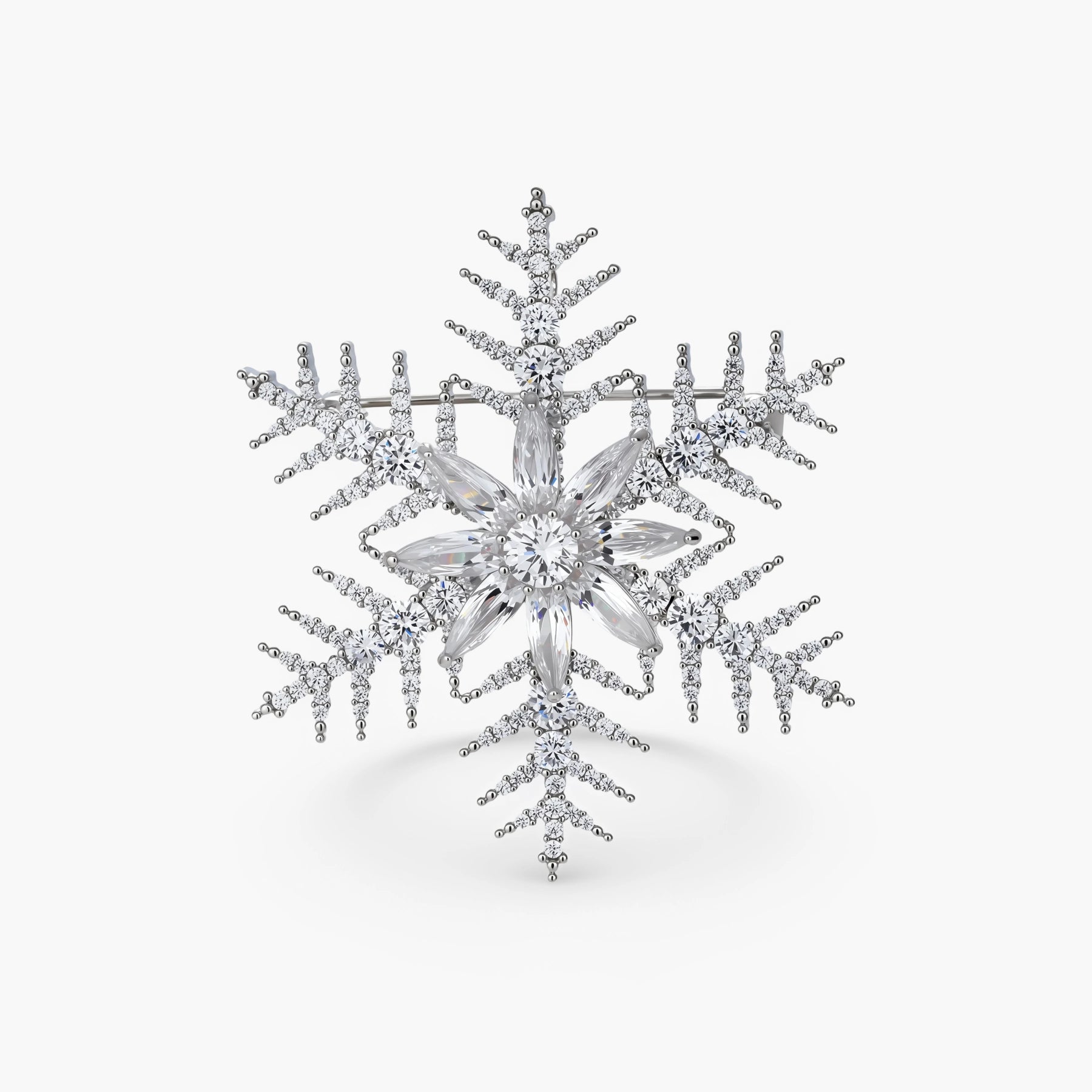 Intricate snowflake brooch with palladium-plated copper setting and sparkling zircon stones in radiating crystal pattern