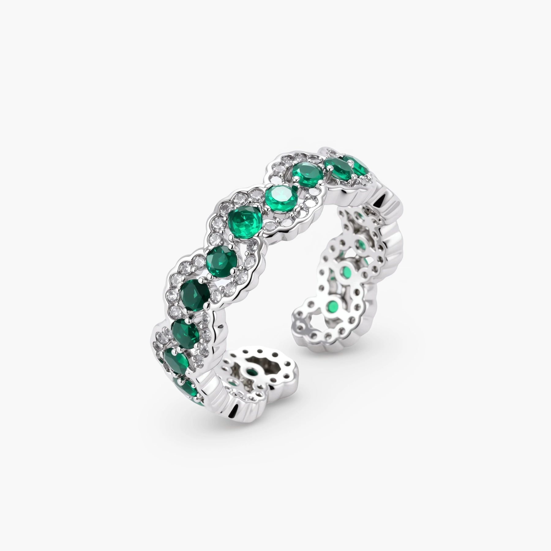 Platinum-plated copper ring with green zirconia stones in decorative scalloped wave pattern, adjustable band design.