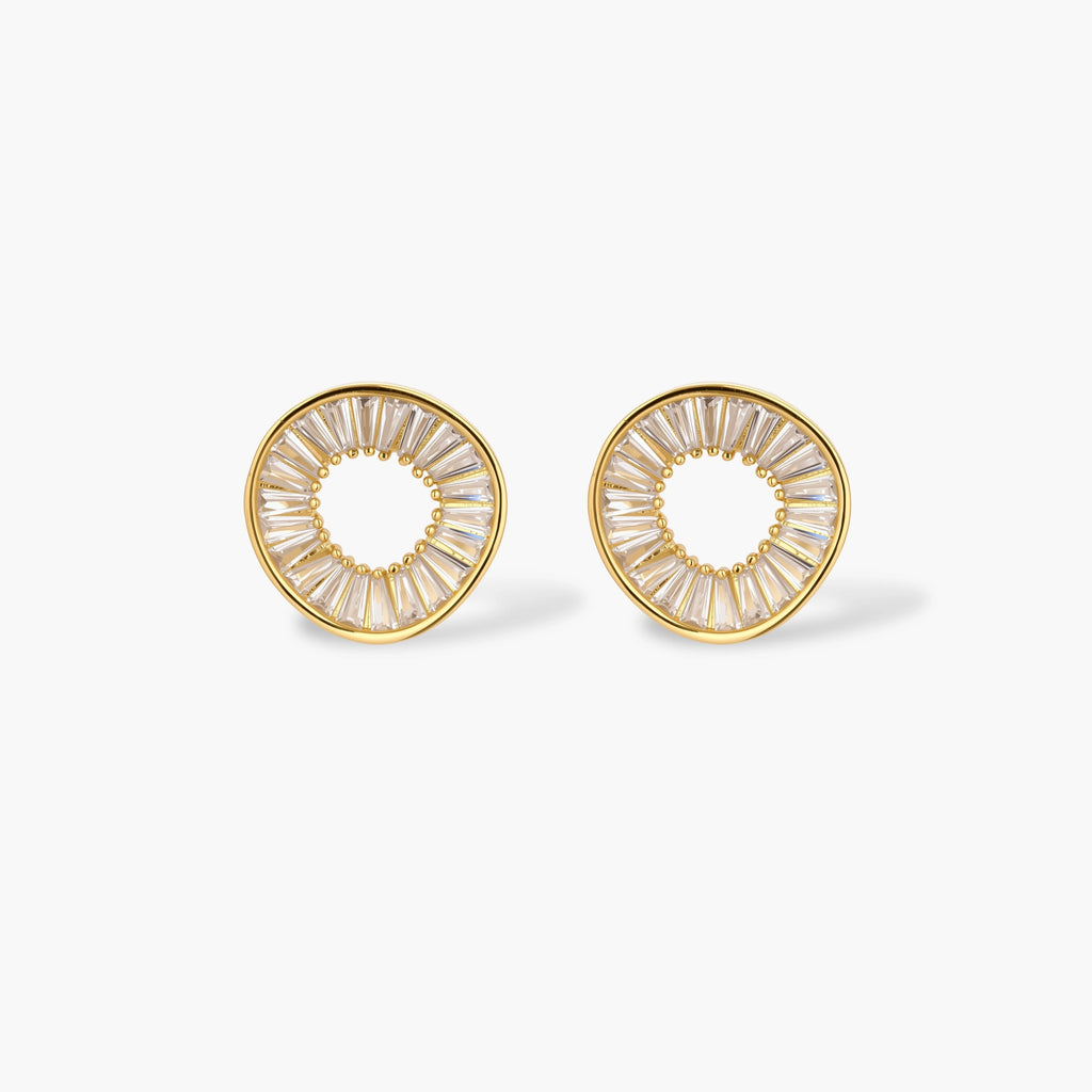 Gold-plated necklace and earring set with circular CZ crystal pendants featuring radial design on cream background