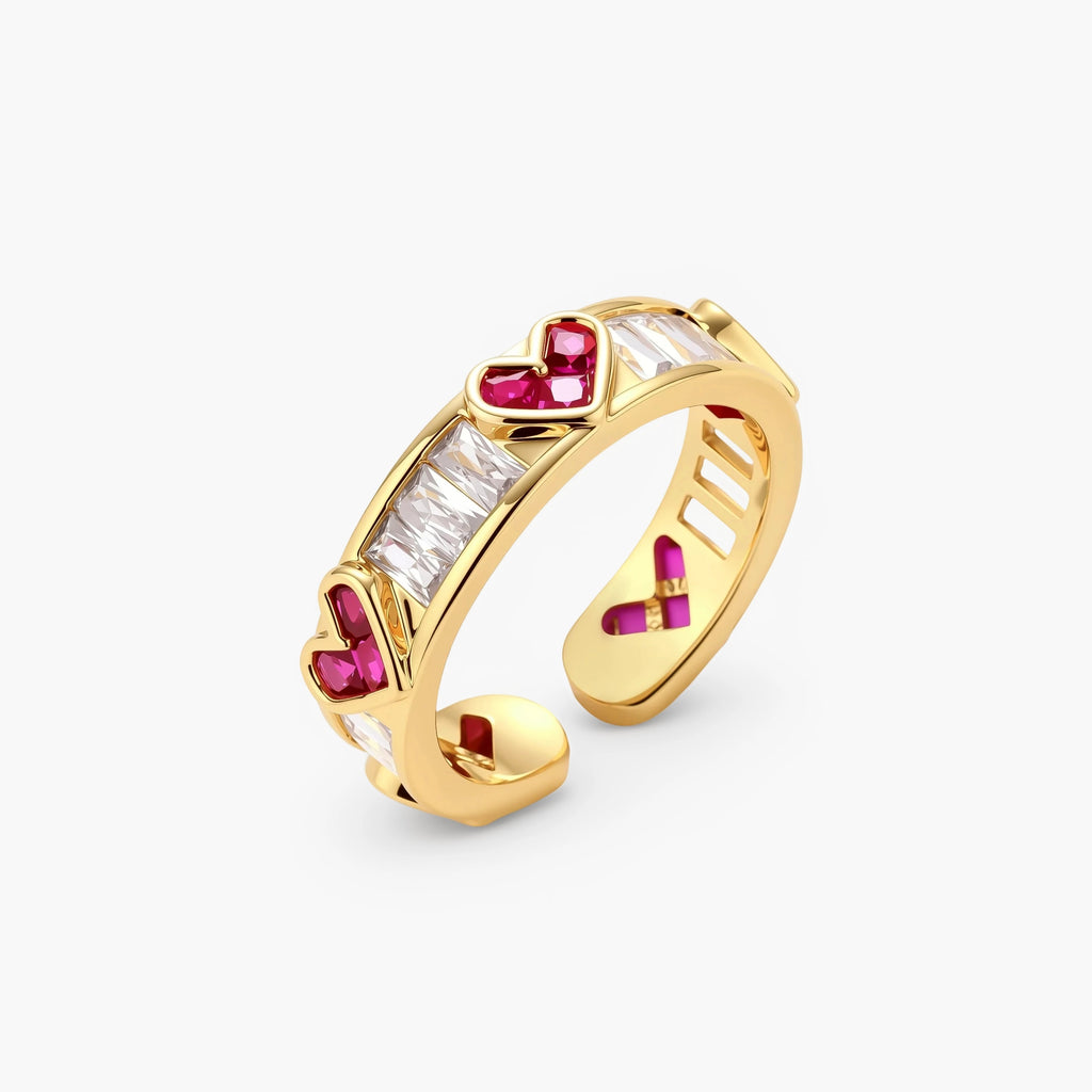 Gold-plated adjustable ring with alternating red heart-shaped and clear rectangular zirconia stones in geometric pattern