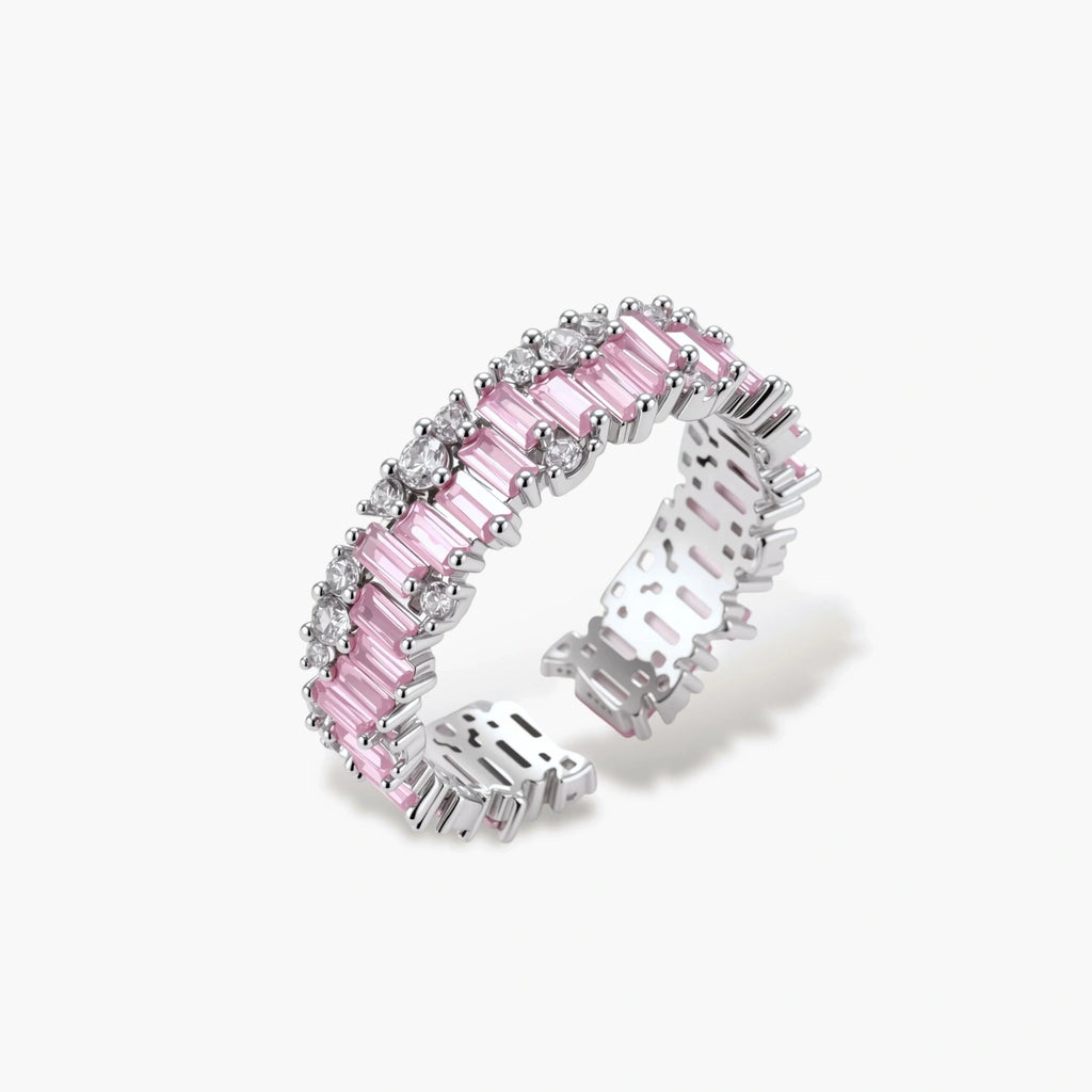 Adjustable eternity ring with alternating pink baguette and clear round cubic zirconia stones in palladium-plated setting