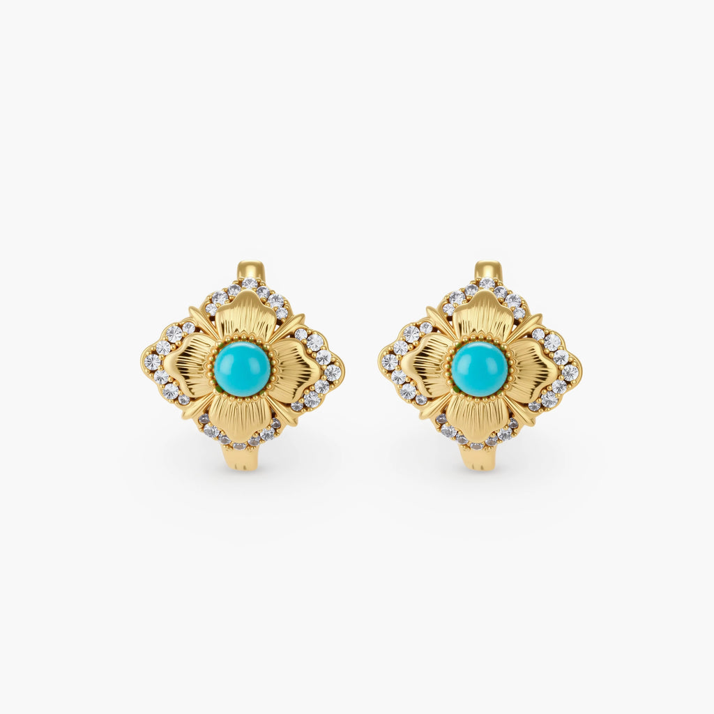 Close-up of 18K gold plated hoop earrings with turquoise center stones and zircon crystals in quatrefoil flower design